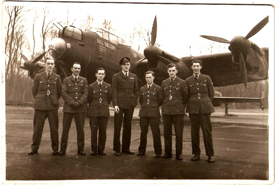The seven-man crew of Bill the Conk, posed in front of their Lancaster bomber